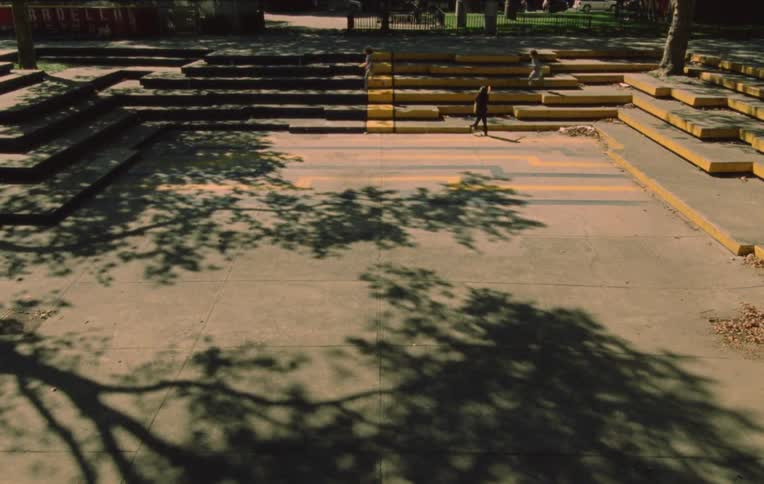 Children playing in a public area running after each other