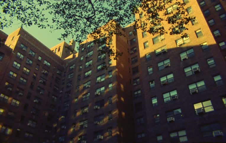 The apartment building has many windows
