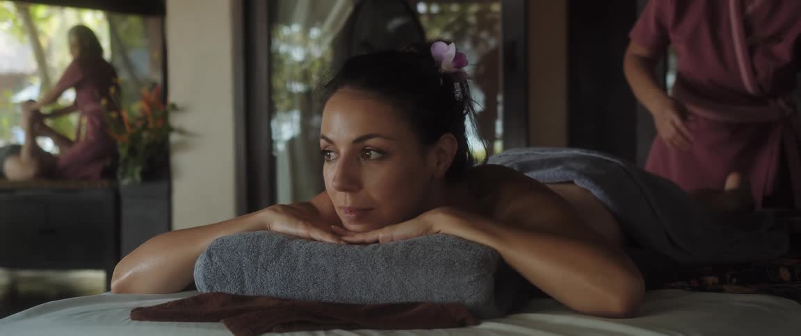 Closeup of a woman lying on a massage table to receive a massage
