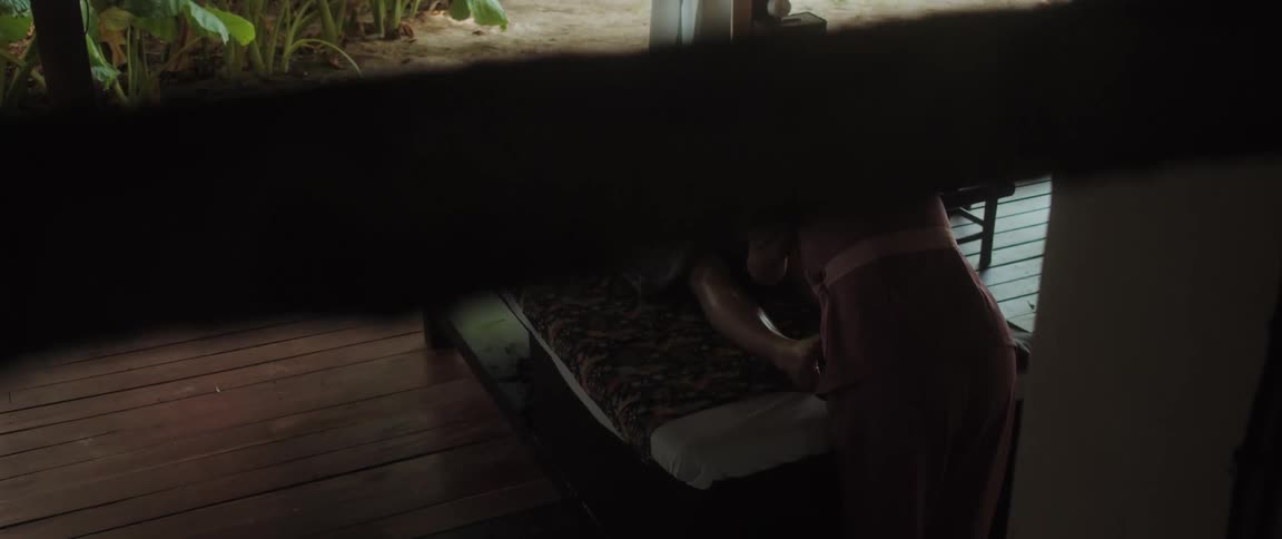 Woman is getting a massage at an outdoor spa