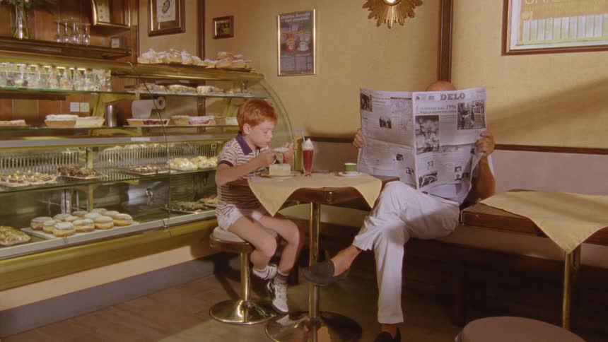 A child eating in an oldfashioned bakery