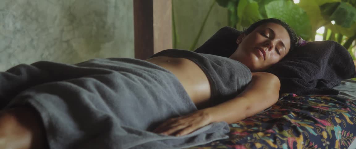 Woman lying on a spa bed sleeping