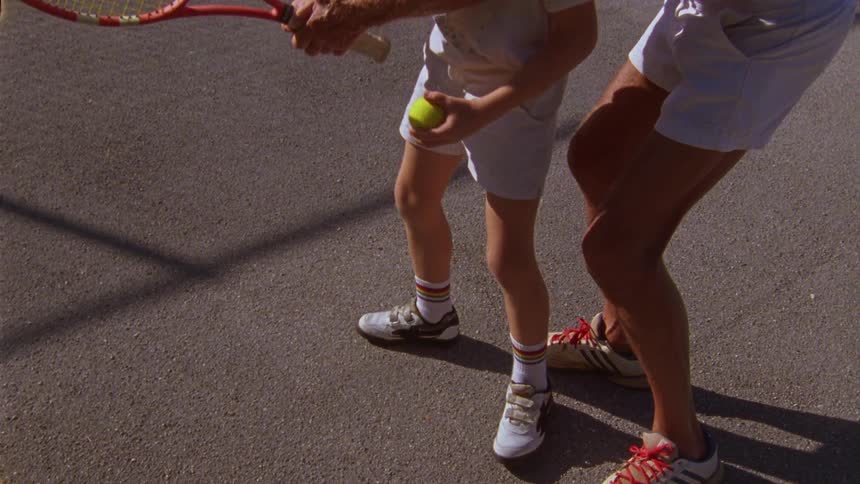 A child is practicing tennis