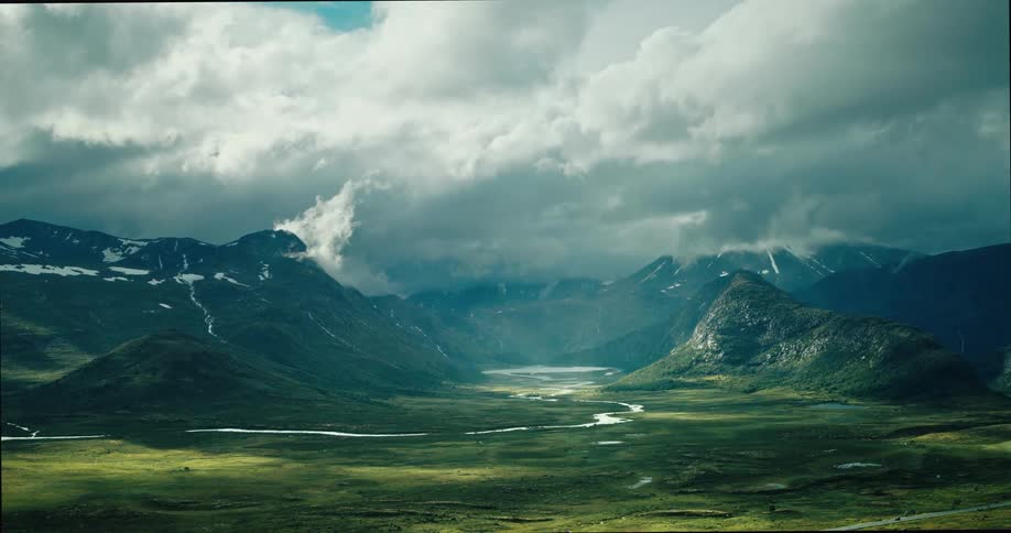 A stream runs towards the mountains