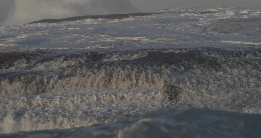 Waves are crashing all over the shore