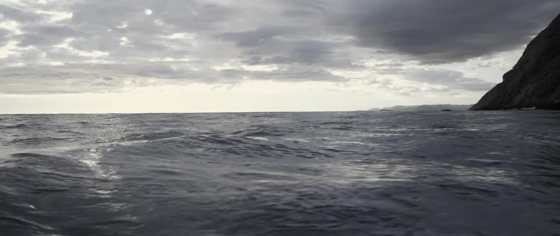 The water starts to form waves on a cloudy day