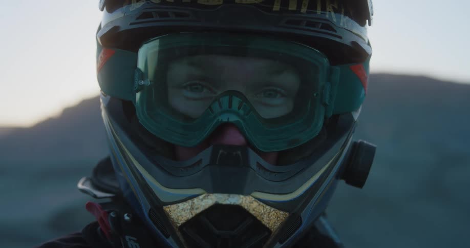 Close up of a person wearing a helmet and goggles outdoors during the day