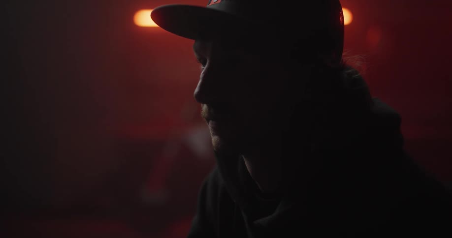 A man in a studio with a determined look on his face