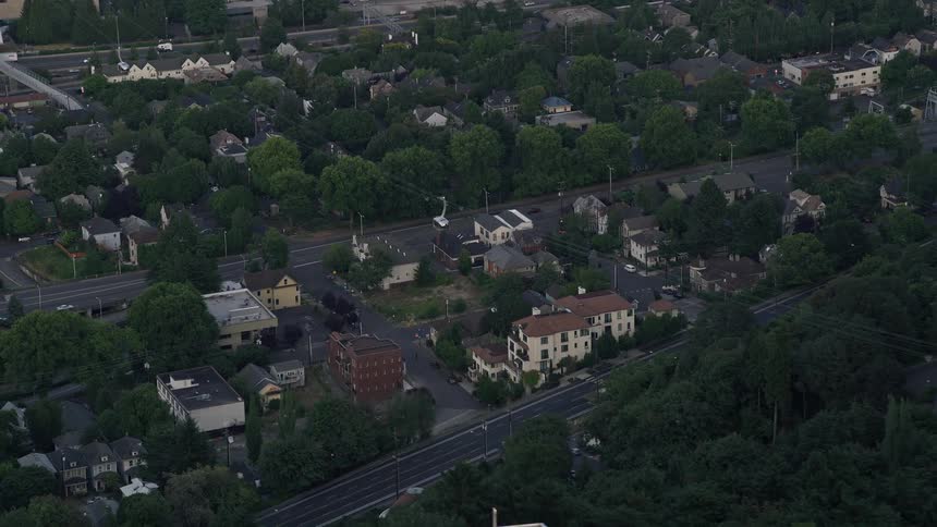 Aerial footage of a cable car tracking towards Oregon Health and Science University in Portland Oregon during sunset