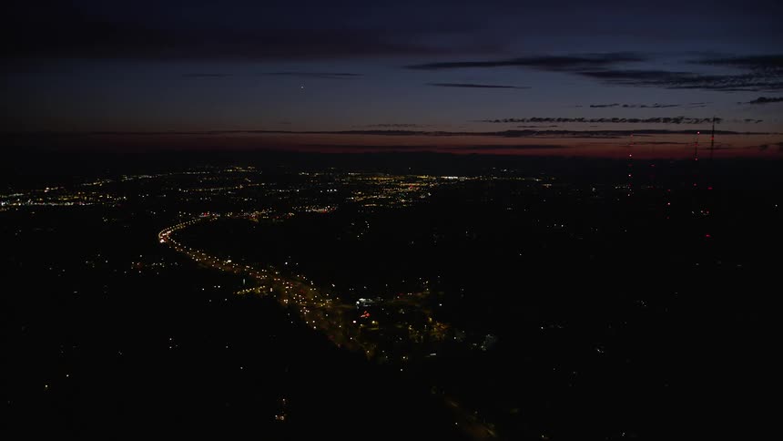 Aerial footage capturing a nighttime view of light traffic on Highway 26 through Southwest Portland Oregon