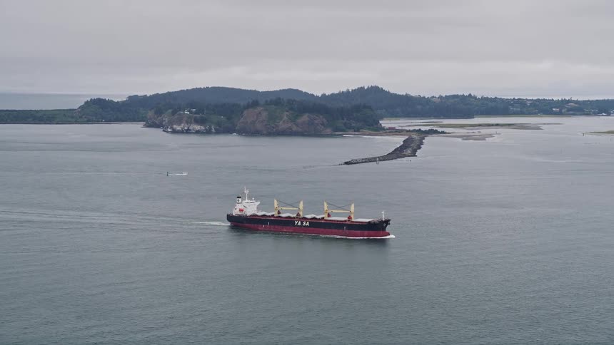 An aerial view of a tanker ship tracking on the Columbia River near Cape Disappointment Washington showcasing the industrial transportation of oil in the region