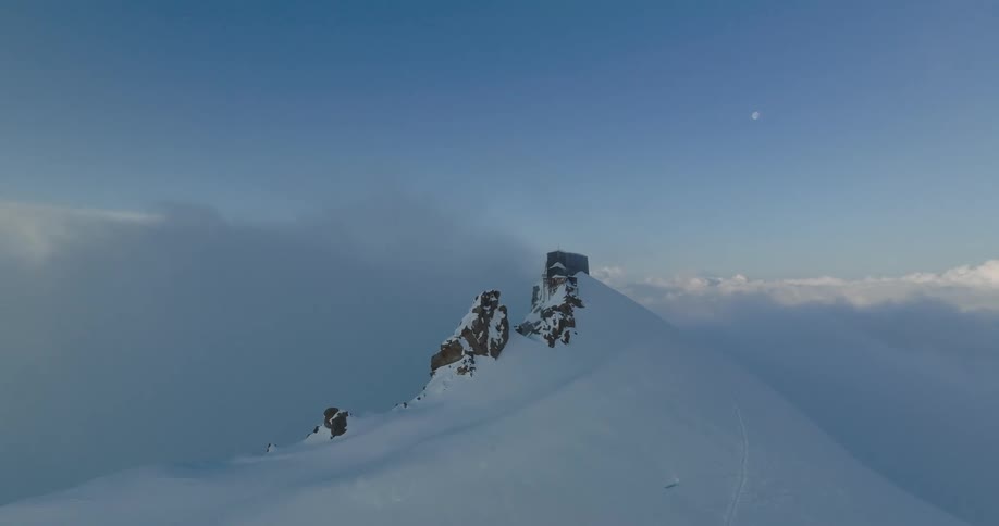 Small abode on a mountain full of snows