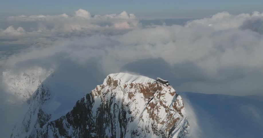 A house on top of a big rocky mountain