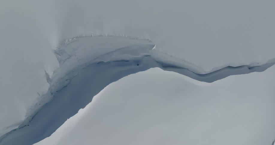 Aerial of a glacial mountain range during a sunny day