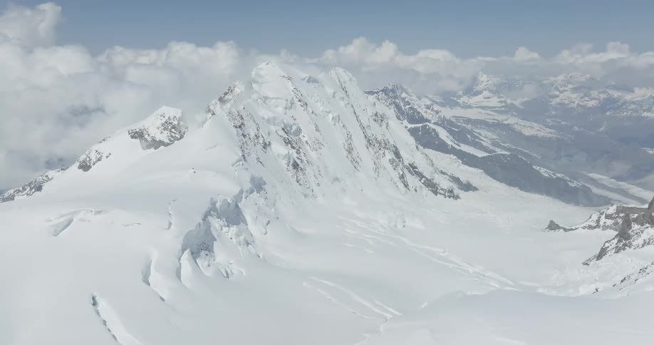 A huge mountain completely covered with snow