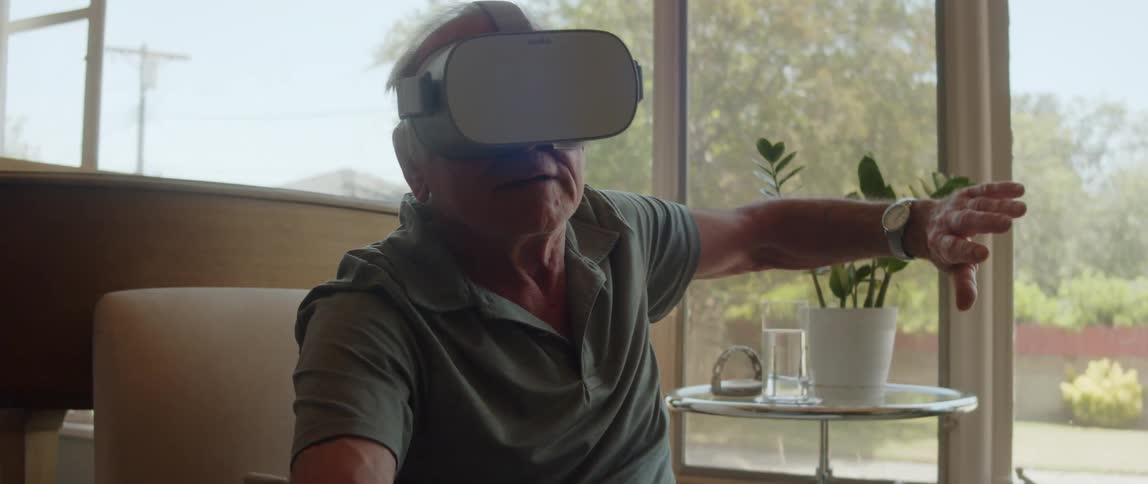 A man is swinging his arms while using virtual reality