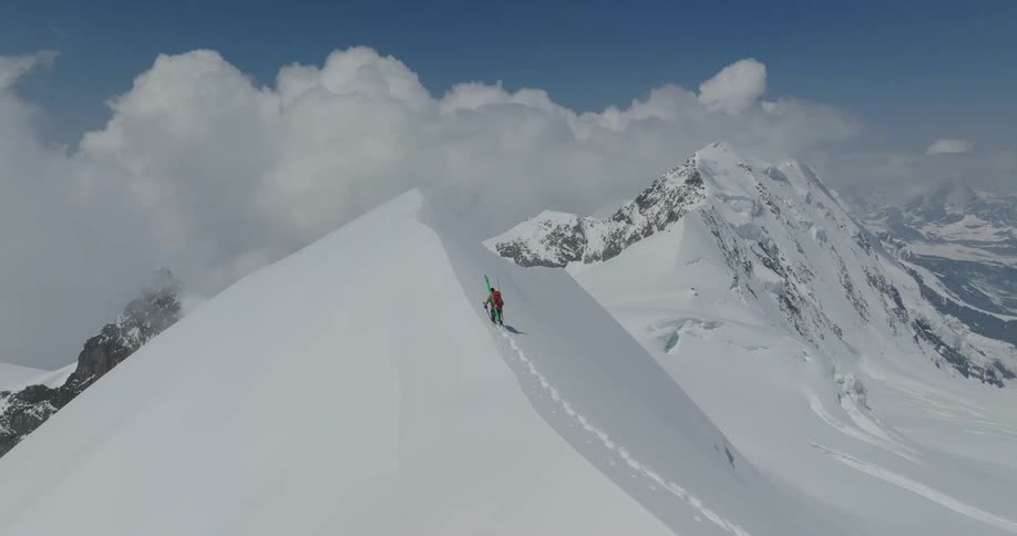 A person climbing an icecovered mountain