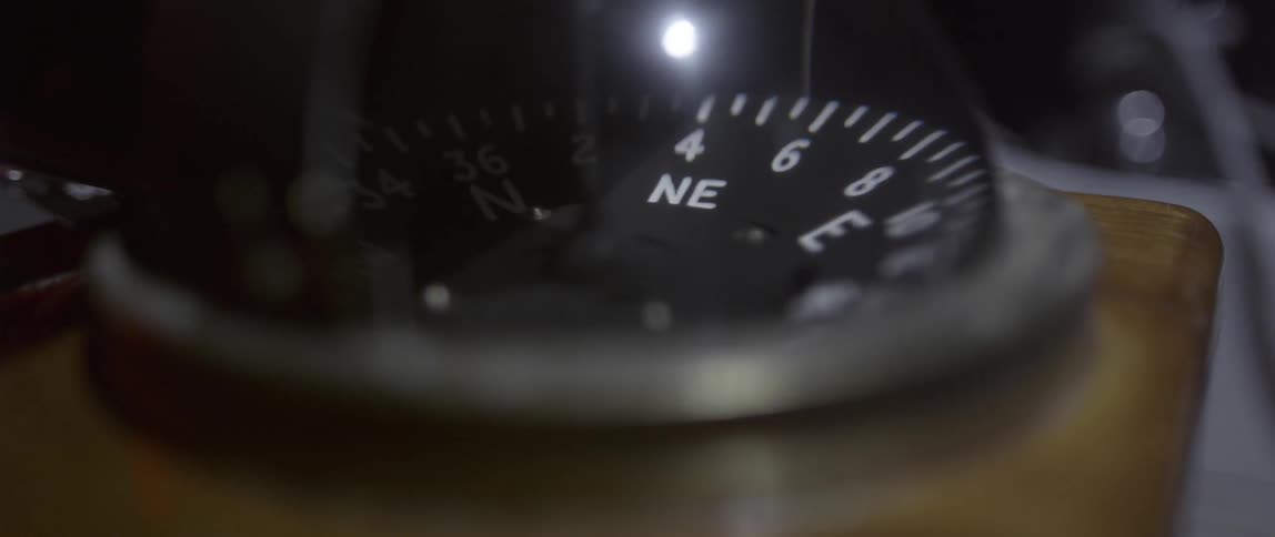 A compass has a glass shell
