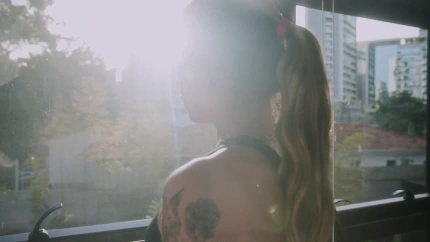 A woman looking out her window