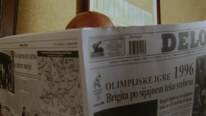 A man opens up a newspaper to read