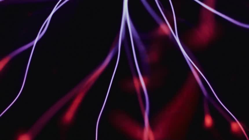 Special effect of purple rays with red tips moving in an abstract manner on a black background