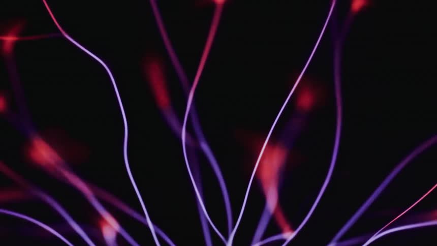 Strings of white light in a dark space with red dot light