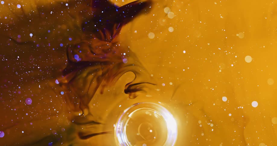 Abstract art with special effects of a bubble moving within yellow and black liquid