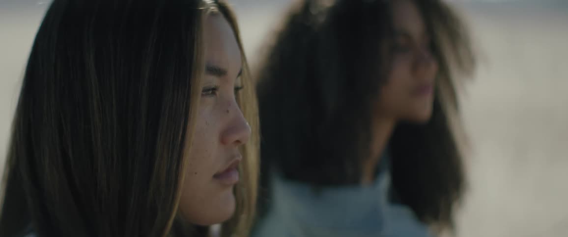 Two women are staring ahead