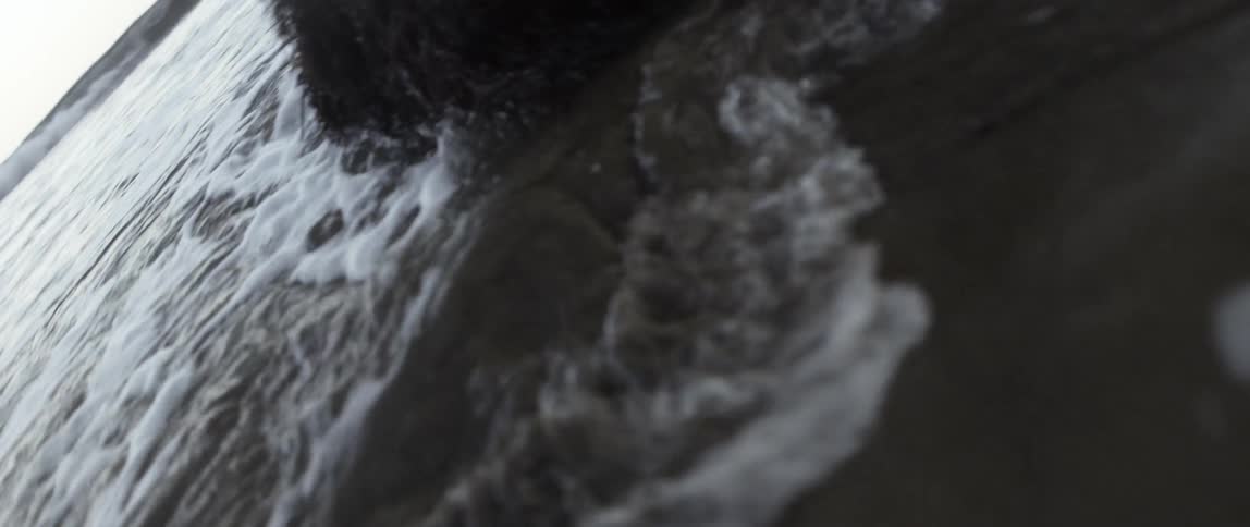 Water moves and swirls around rocks