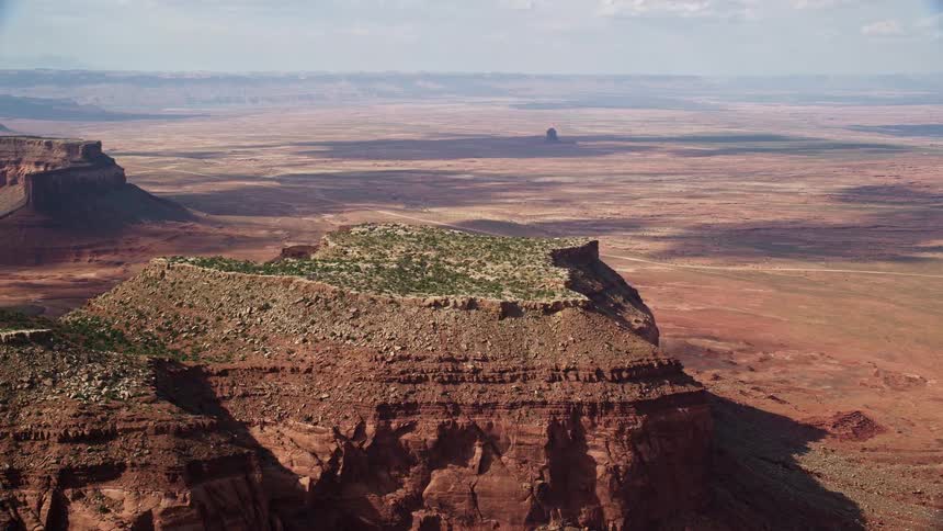  aerial footage captures the breathtaking Southwest desert landscape as the camera flies by desert mesa revealing the stunning second mesa on the Navajo Nation Reservation in Arizona and Utah