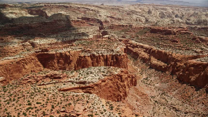 Aerial footage of canyons and mesas in Capitol Reef National Park Utah showcasing the famous red rock formations and breathtaking landscapes