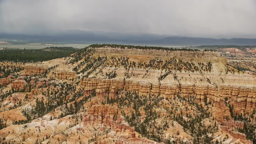 Aerial footage showcasing the majestic hoodoos and mesas at Bryce Canyon National Park Utah on a cloudy day