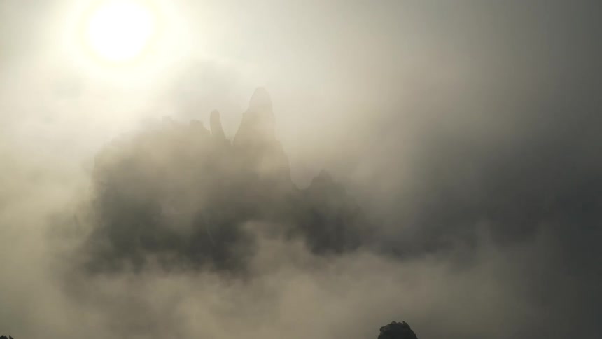 Fog is covering the mountains at dusk