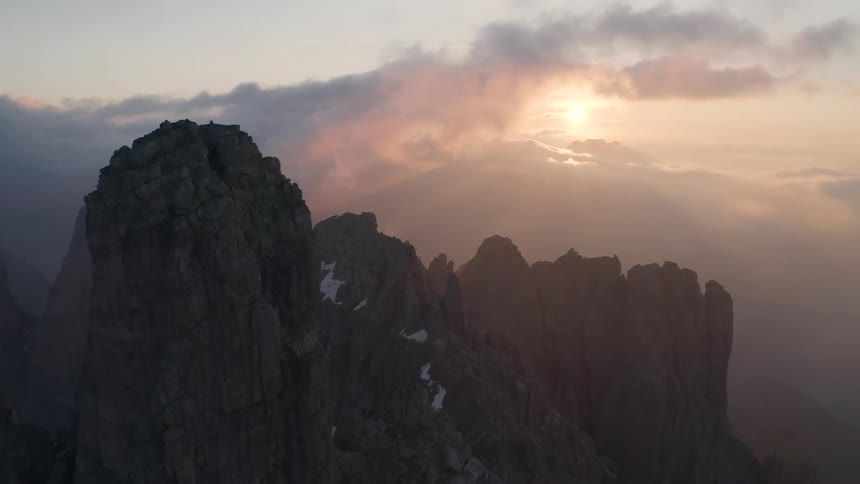 Aerial view of a mountain range is displayed