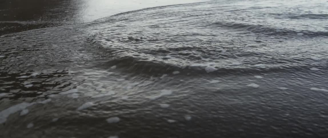 The water moves across the sand