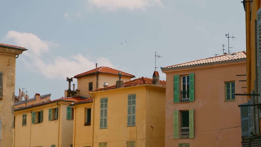 Colorful homes sit close together in a neighborhood