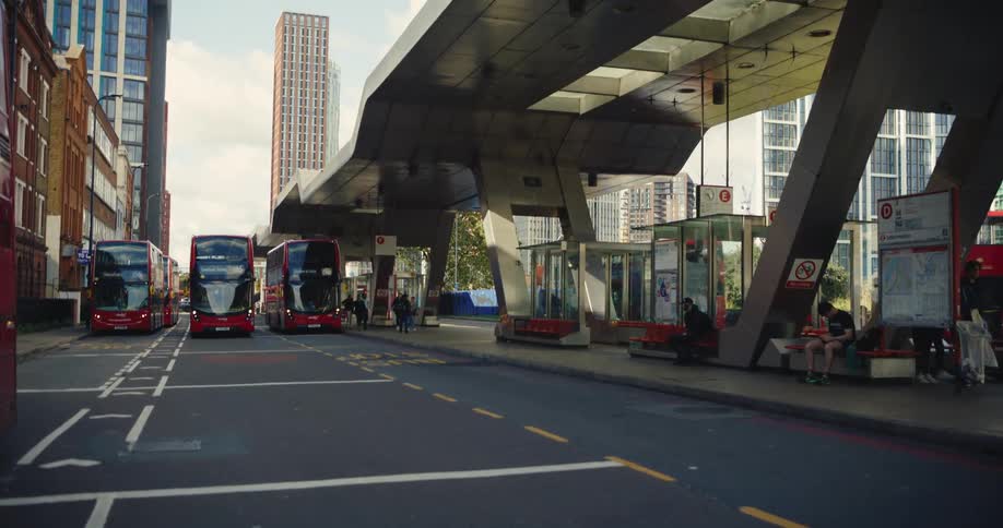 London double-decker busses at bus station in urban London