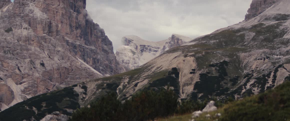 Wild landscape with mountains and a cloudy sky