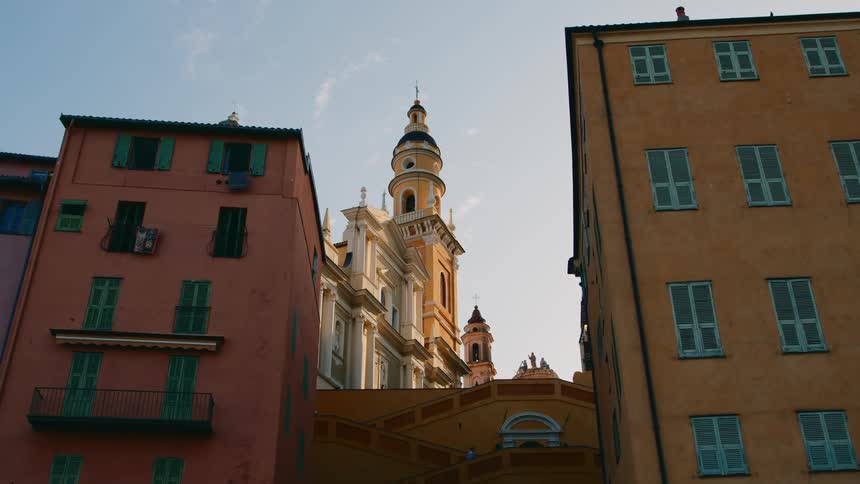 View of a classic church amidst a residential area with buildings of old architecture