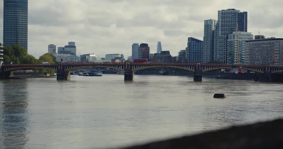 Traffic moving along Vauxhall Bridge over London's River Thames
