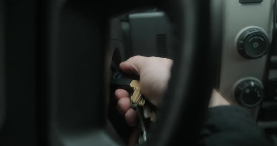 A driver turns keys in an ignition