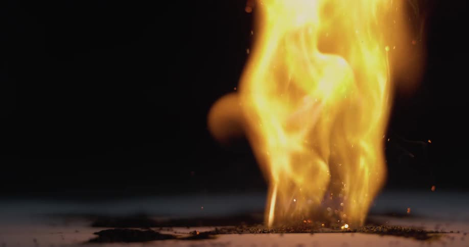 A flame burns on powder