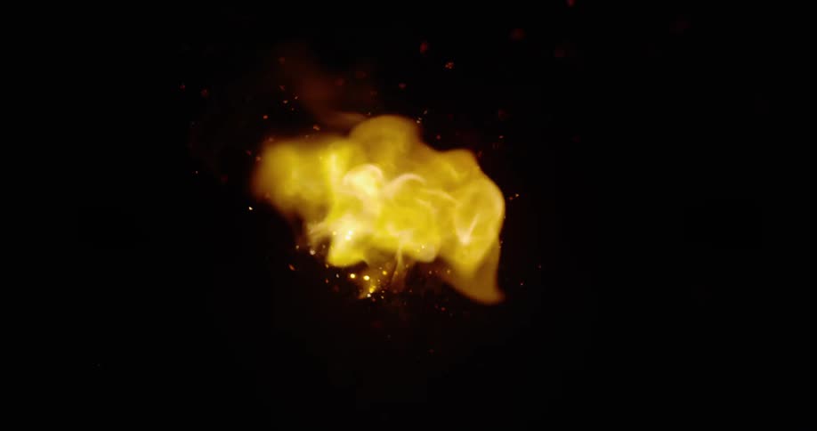 The fire sprays in the dark