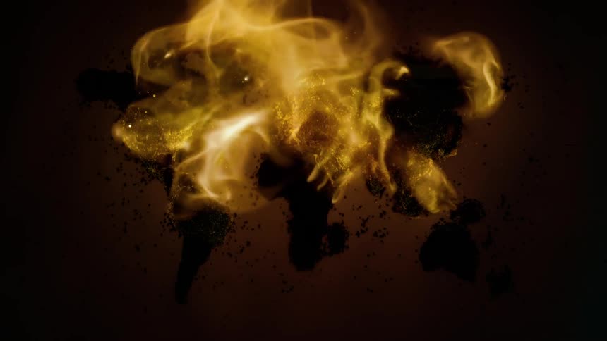 Flames rise from the burning embers