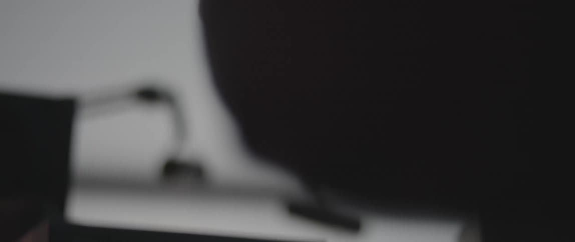 A person slams his fist down on a static filled monitor