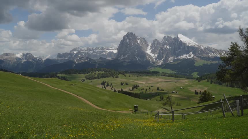Snowy mountains in the flat landscape in spring