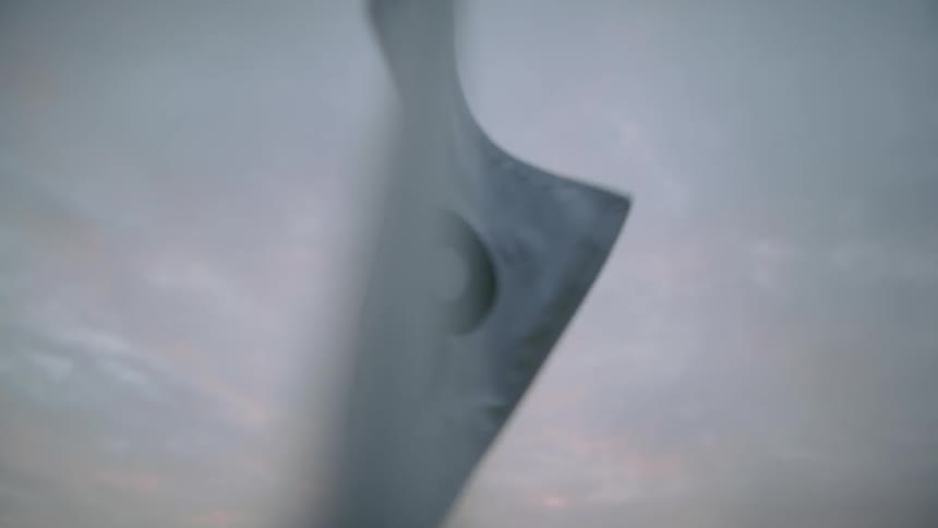 Close up of a small white flag moving with the force of the wind
