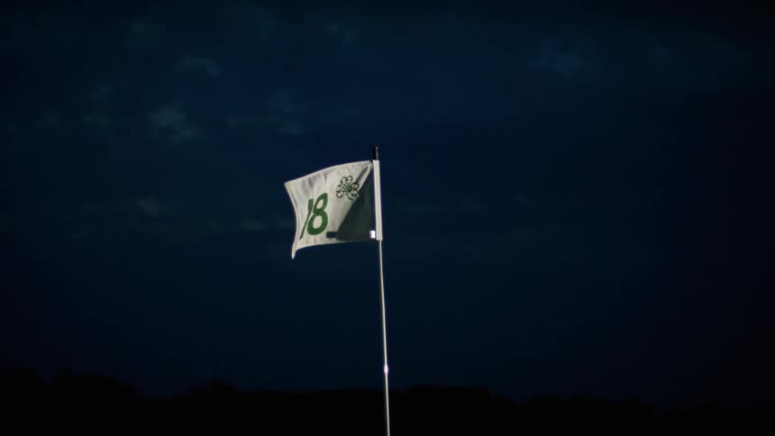 Number eighteen flag waves in the dark