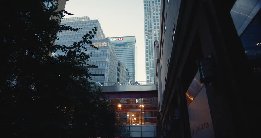 View of a city with public areas and tall skyscrapers on a cloudy day