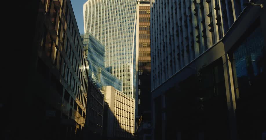 Car driving through a metropolis with skyscrapers